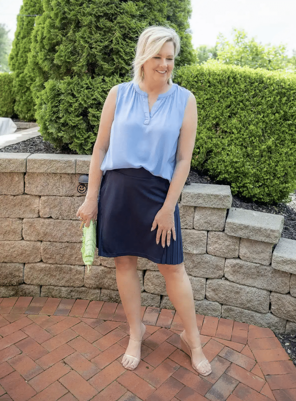 Tania Stephens is wearing a navy tennis skirt with pleats